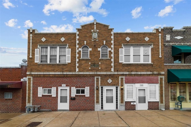 view of front of house with brick siding