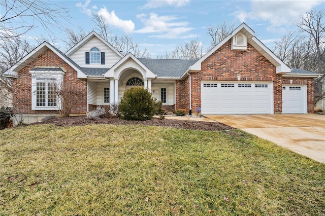 traditional-style home featuring driveway, brick siding, a shingled roof, an attached garage, and a front yard