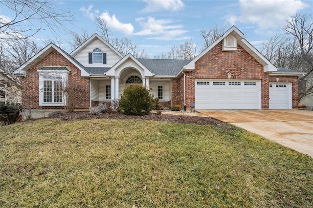 traditional-style house with brick siding, a shingled roof, a garage, driveway, and a front lawn