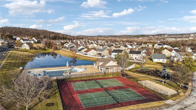 bird's eye view with a water view and a residential view