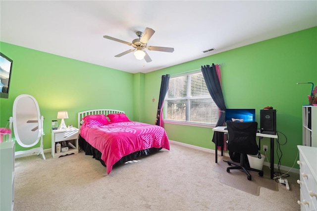 bedroom with a ceiling fan, light colored carpet, and baseboards