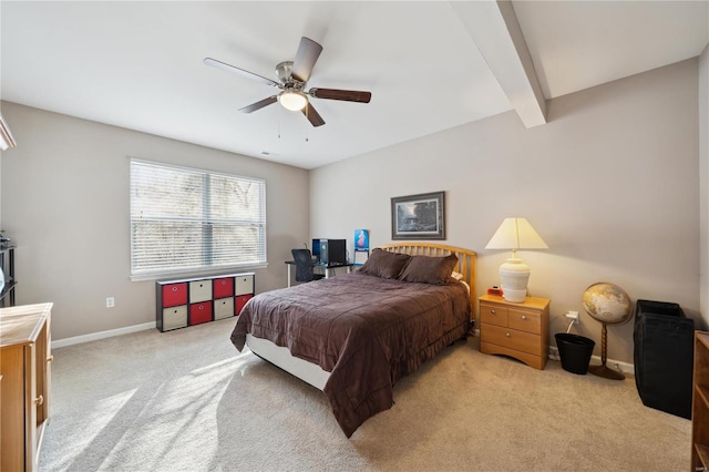 bedroom with baseboards, ceiling fan, beamed ceiling, and light colored carpet