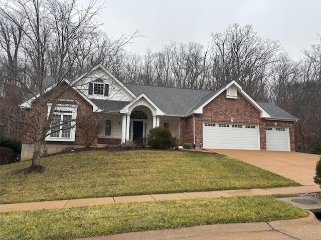 view of front of house featuring an attached garage, a front yard, concrete driveway, and brick siding