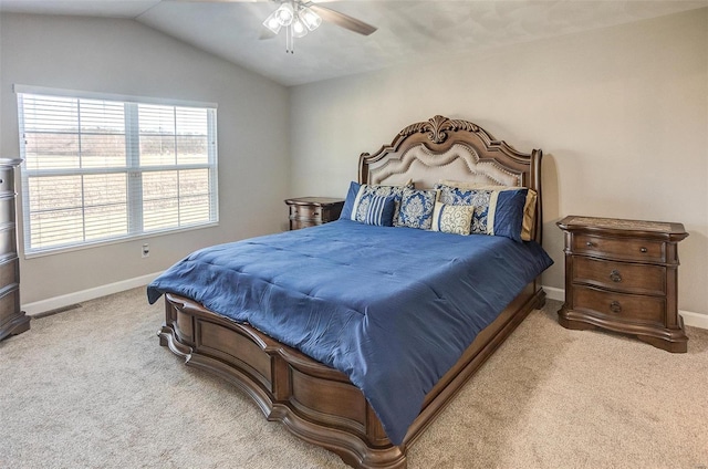 bedroom featuring lofted ceiling, light carpet, ceiling fan, and baseboards