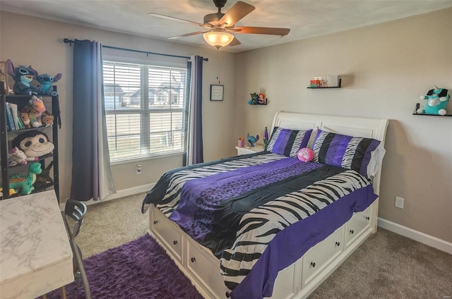 carpeted bedroom featuring ceiling fan and baseboards