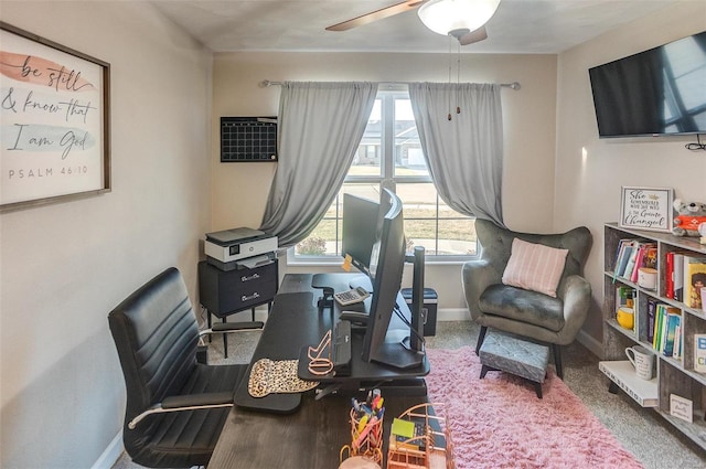 sitting room featuring baseboards and a ceiling fan