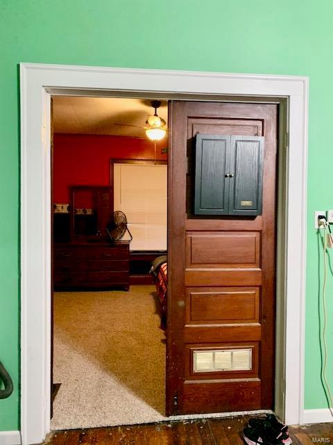 interior space with dark colored carpet