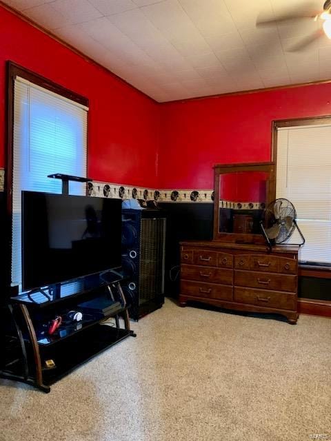 bedroom with a ceiling fan and carpet flooring