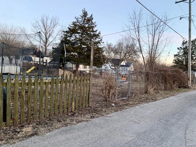 gate at dusk with fence