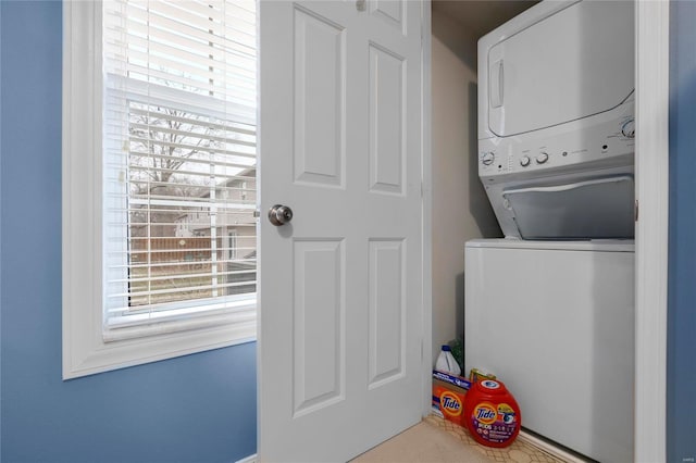 laundry area featuring laundry area and stacked washing maching and dryer