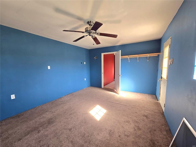 unfurnished bedroom featuring carpet and ceiling fan