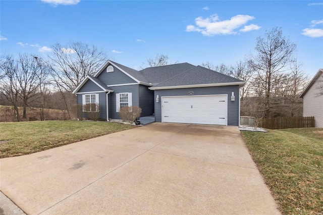 view of front facade with a garage, fence, concrete driveway, roof with shingles, and a front lawn