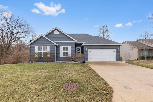 single story home featuring a garage, driveway, and a front lawn