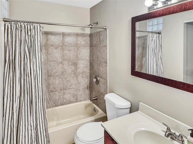 full bathroom featuring shower / tub combo, vanity, and toilet