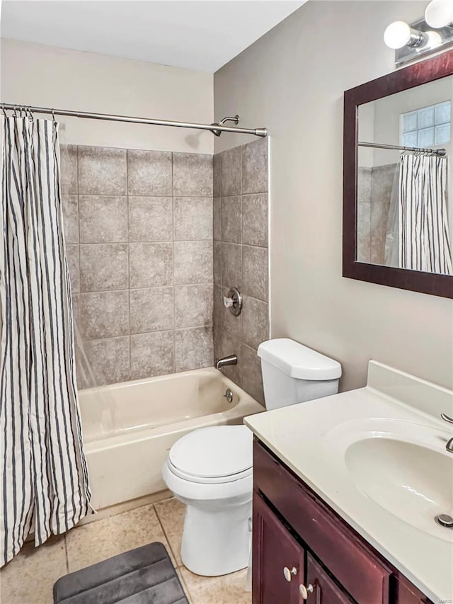 bathroom with shower / bath combo, vanity, toilet, and tile patterned floors