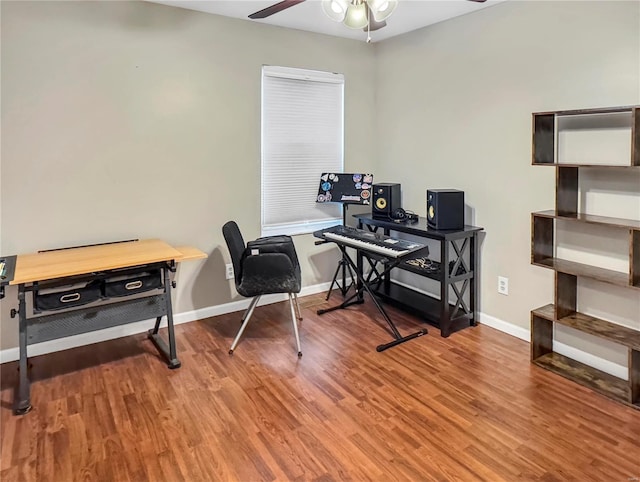 office featuring ceiling fan, baseboards, and wood finished floors