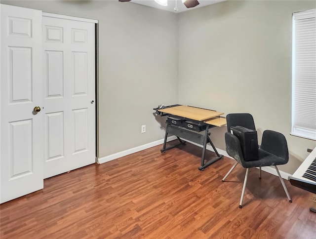 office with ceiling fan, wood finished floors, and baseboards