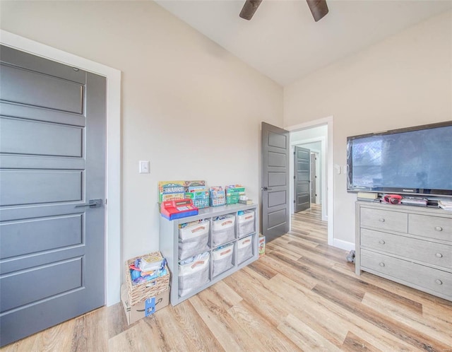 rec room with ceiling fan and light wood-type flooring