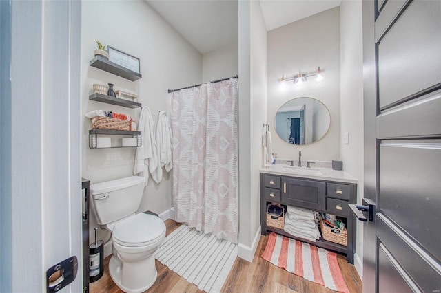 full bathroom with toilet, wood finished floors, vanity, baseboards, and a shower with curtain