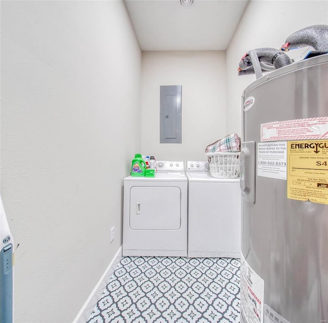 laundry room with washing machine and dryer, laundry area, baseboards, water heater, and electric panel