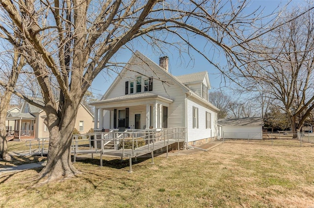 view of front of house featuring a porch, a garage, fence, a front lawn, and a chimney