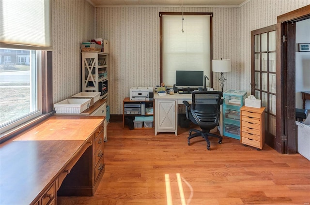 office space featuring light wood finished floors and wallpapered walls