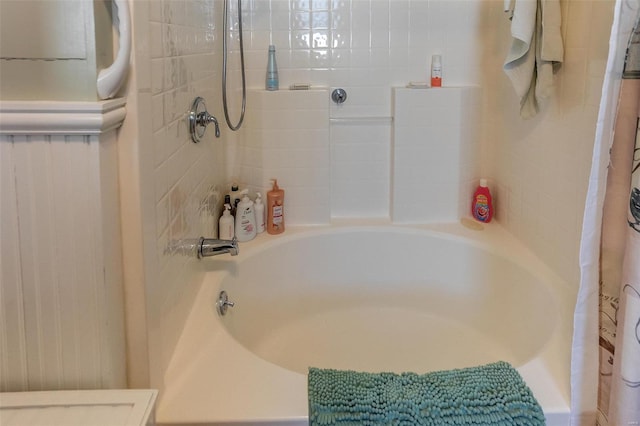 bathroom featuring shower / tub combo with curtain