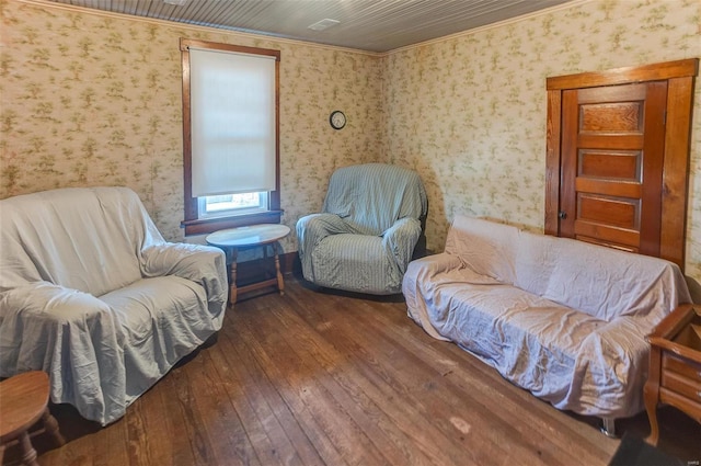 sitting room with wallpapered walls and hardwood / wood-style floors