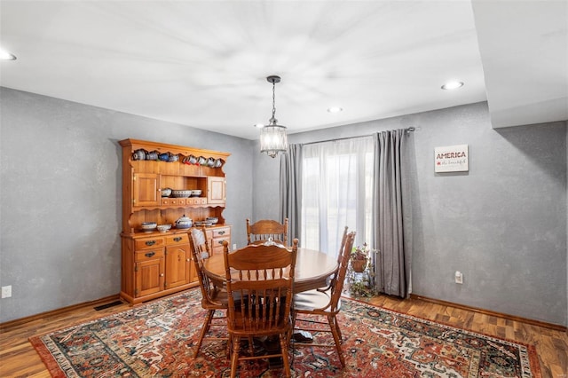 dining room featuring baseboards, recessed lighting, visible vents, and light wood-style floors