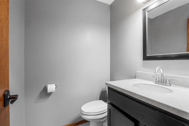 half bath with vanity and toilet