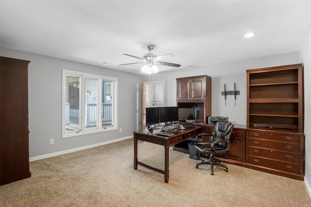 office featuring recessed lighting, light carpet, ceiling fan, and baseboards