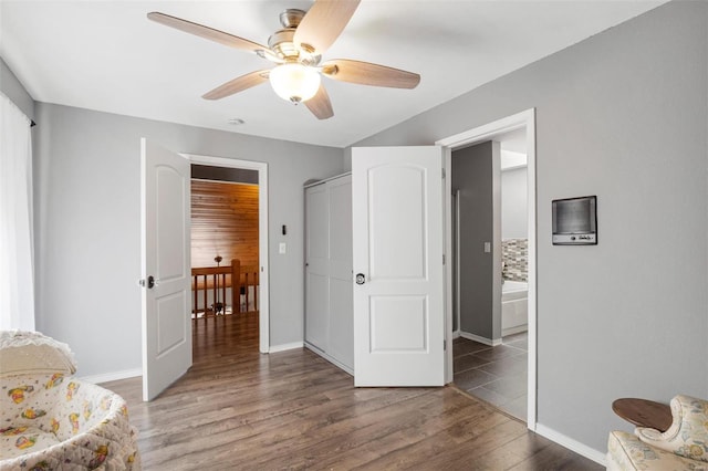 sitting room featuring ceiling fan, baseboards, and wood finished floors