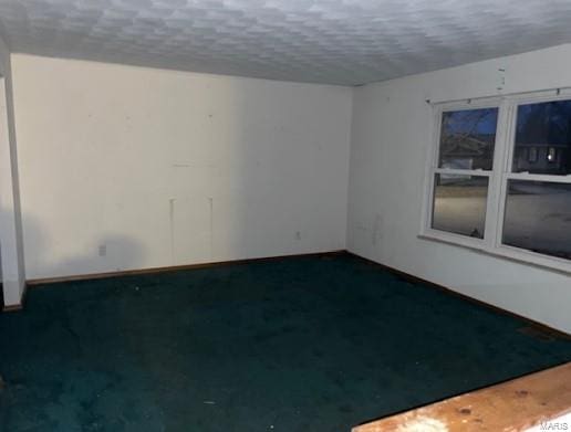 empty room with a textured ceiling