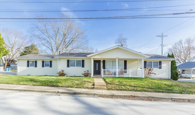 single story home featuring a porch and a front yard