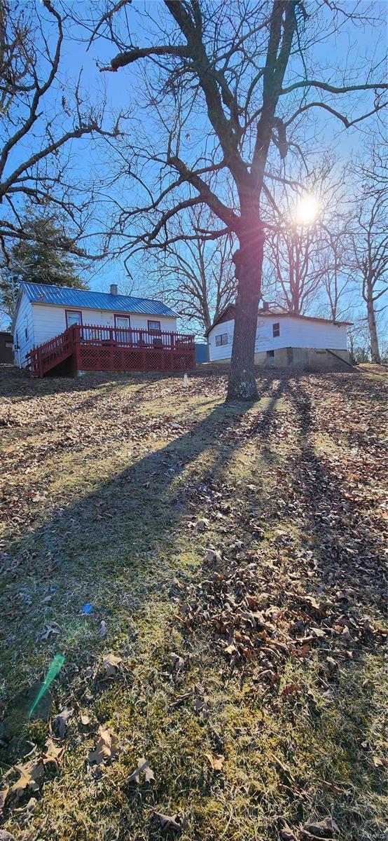 view of yard featuring a wooden deck