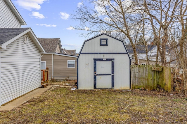 view of shed with fence