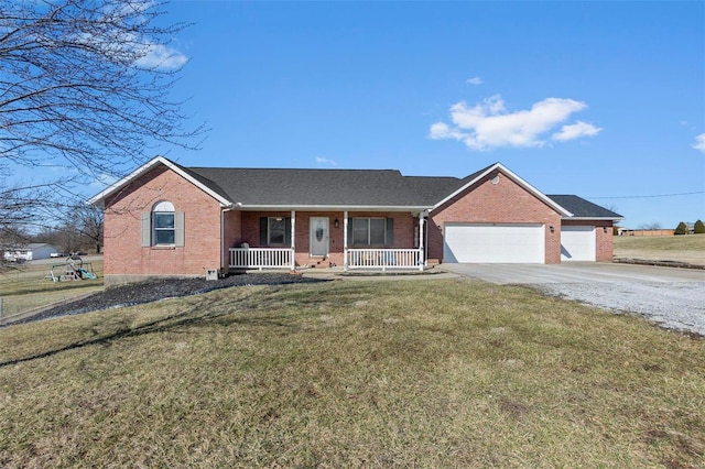 ranch-style home with an attached garage, a front yard, a porch, and brick siding