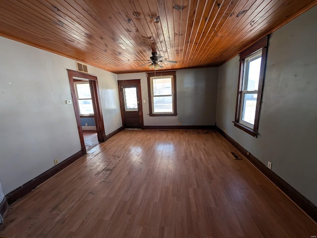 foyer entrance with plenty of natural light, visible vents, and wood finished floors