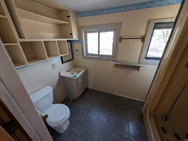 bathroom with vanity and toilet