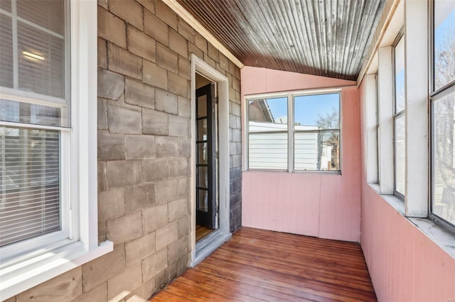 unfurnished sunroom with lofted ceiling and wood ceiling