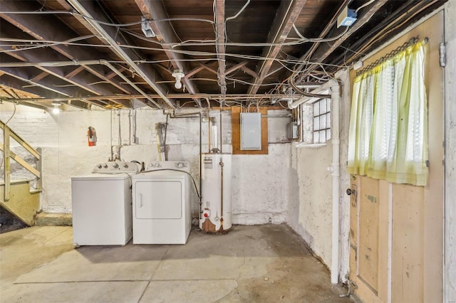 basement with electric panel, water heater, and washing machine and clothes dryer