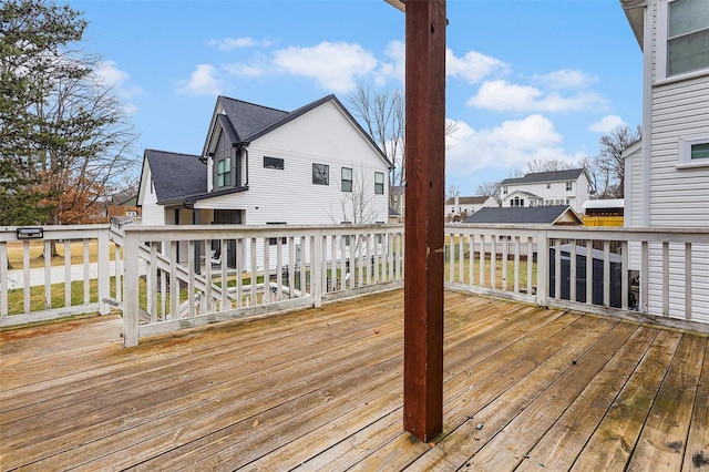 wooden deck featuring a residential view