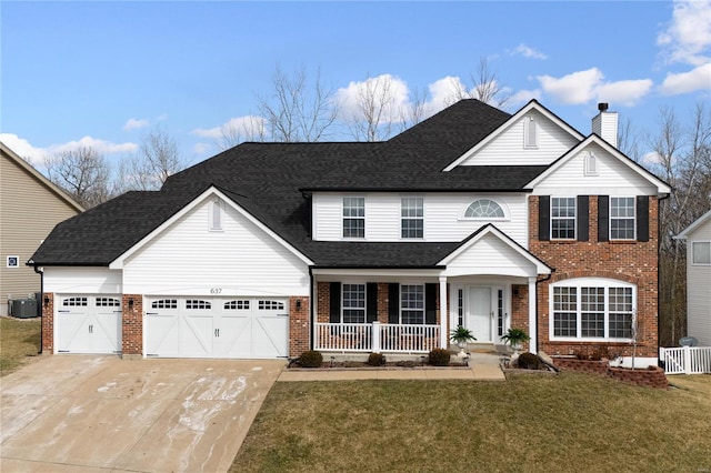 view of front facade featuring covered porch, brick siding, driveway, and a front lawn