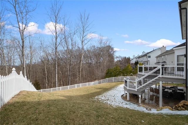 view of yard featuring a fenced backyard, stairway, and a wooden deck