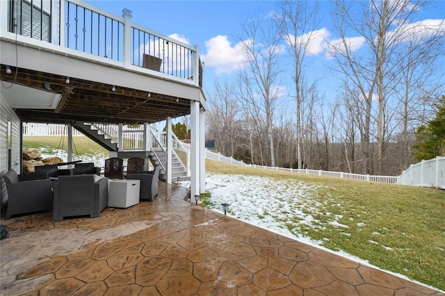 view of patio / terrace featuring stairs and fence