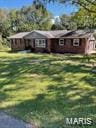 ranch-style house with a front yard