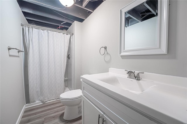 full bath featuring vanity, wood finished floors, toilet, and a shower with curtain