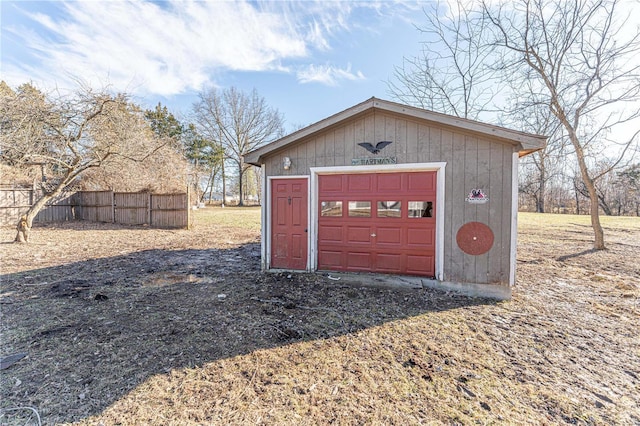 garage with fence