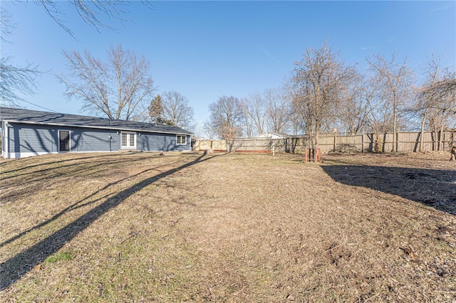 view of yard with a fenced backyard