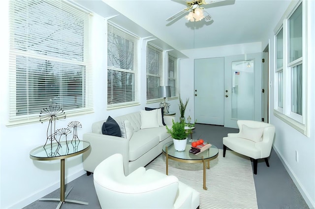 sunroom featuring a ceiling fan